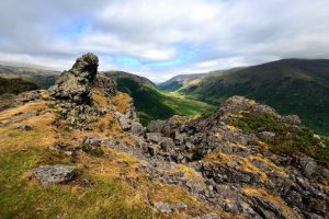 The rocky outcrop at the top of Helm Cragg, overlooking the valley below. 